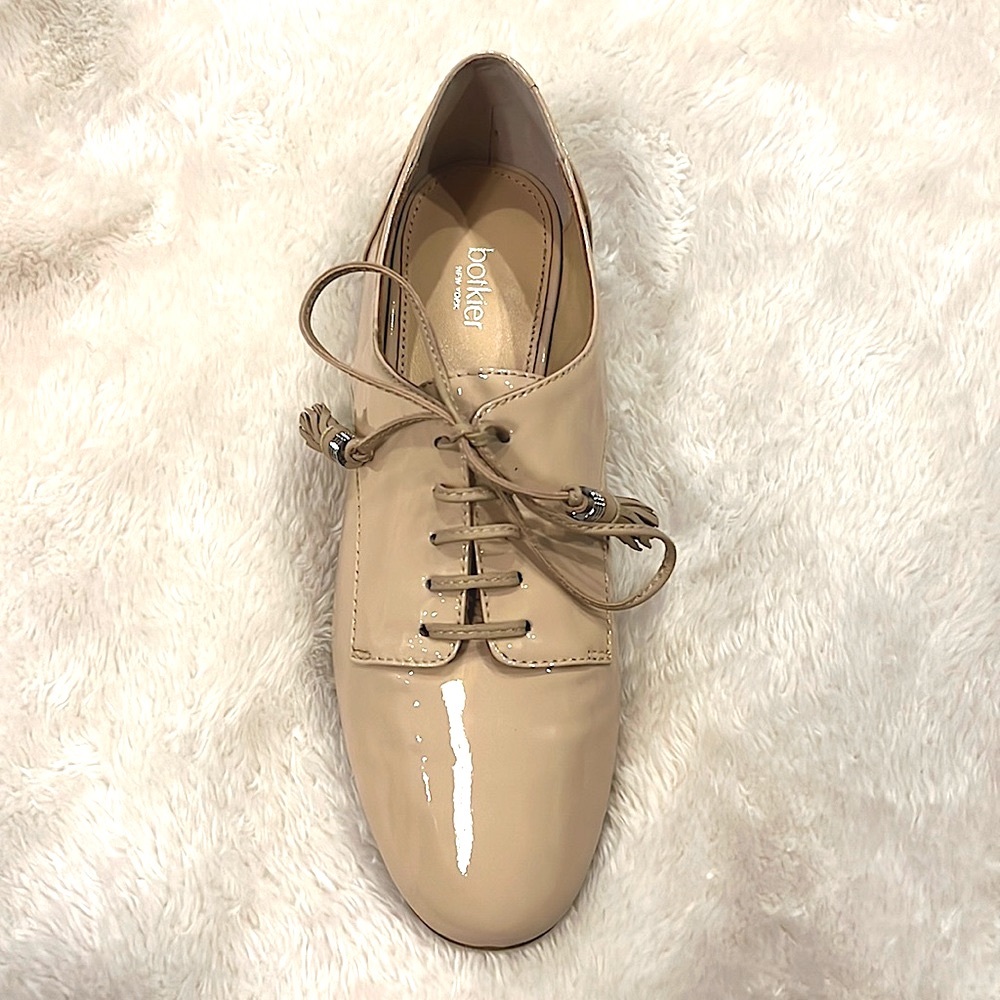 New Oxfords in the box. Light pink patent leather lace ups with tassels. 6.5 US